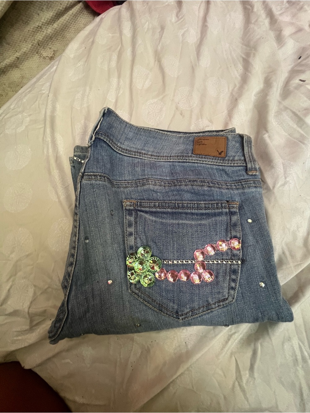 American Eagle Outfitters Blue Denim Bootcut Jeans with Rhinestone Floral Pocket